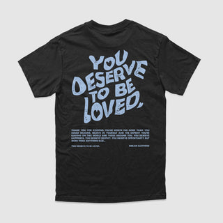 You Deserve To Be Loved Black Tee (Powder Blue Print)