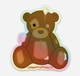 Handle With Care StickerOur Handle with Care Stickers feature Patches the Dream Teddy Bear. Patches is a reminder that we're capable of overcoming anything that comes our way. It's a gentleDREAM Clothing 