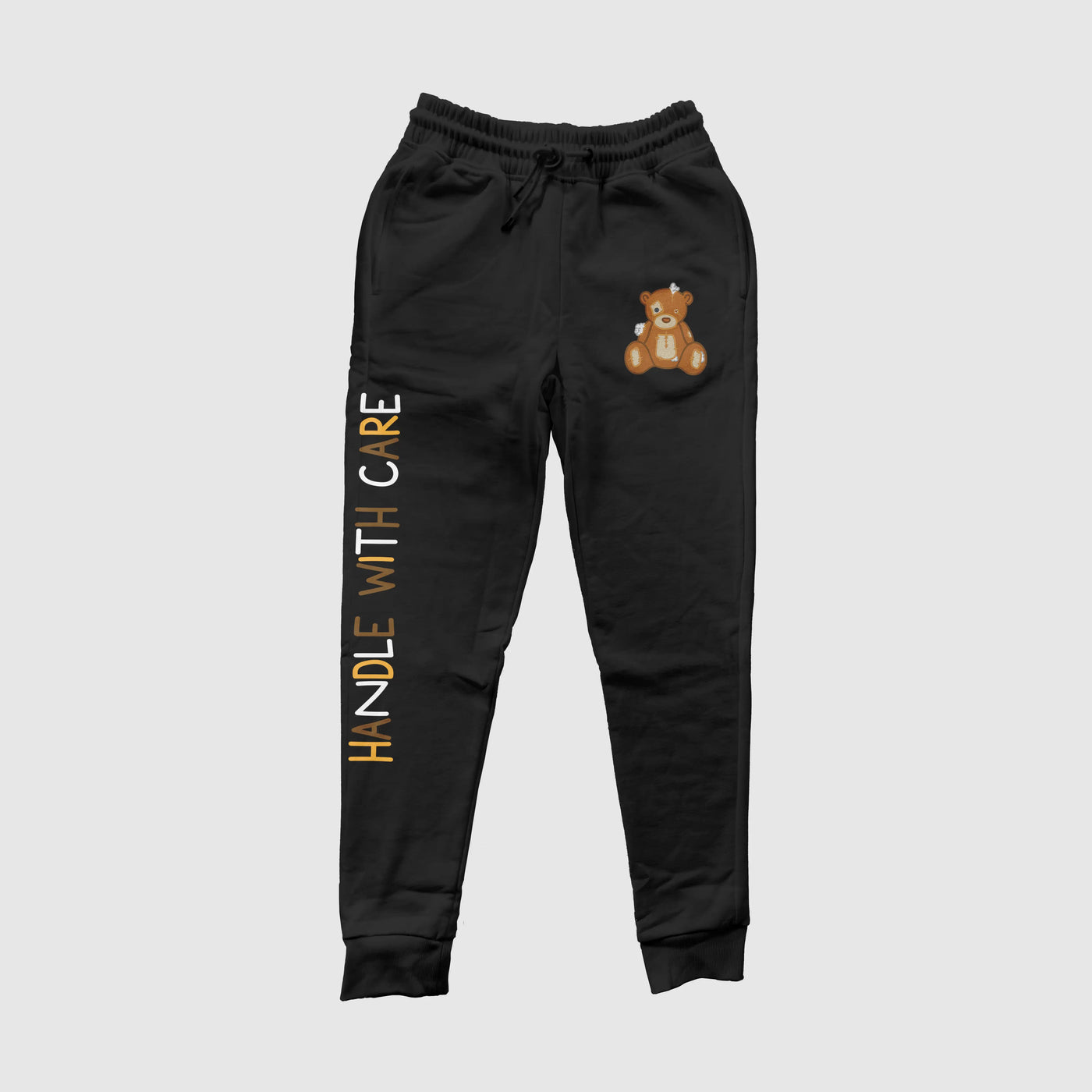 Handle With Care Black Jogger Pants





Our Handle with Care Joggers feature Patches the Dream Teddy Bear. Patches is a reminder that we're capable of overcoming anything that comes our way. It's a gDREAM Clothing 